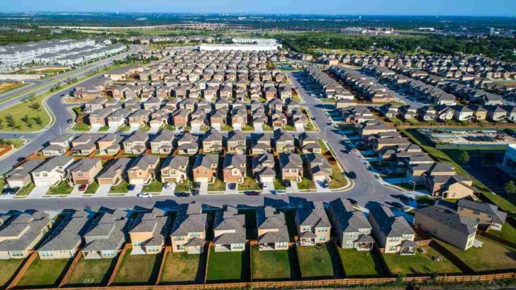 Perfect Standard Suburban Neighborhood Aerial Drone View above the entire development in North Austin right next to Round Rock , TX a perfect repeating pattern of Homes wide angle entire neighborhood