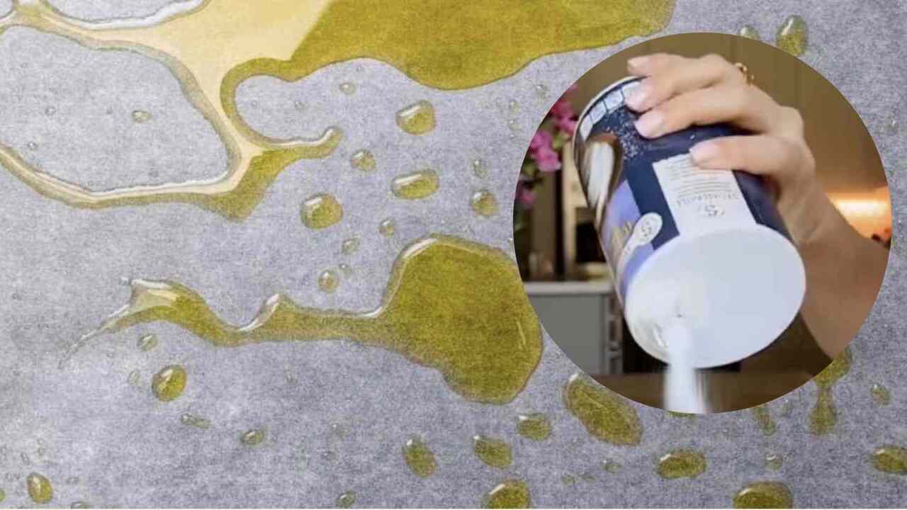 Soľ nasypaná na rozliaty olej na kuchynskej doske, ukážka jednoduchého triku na čistenie mastnoty.