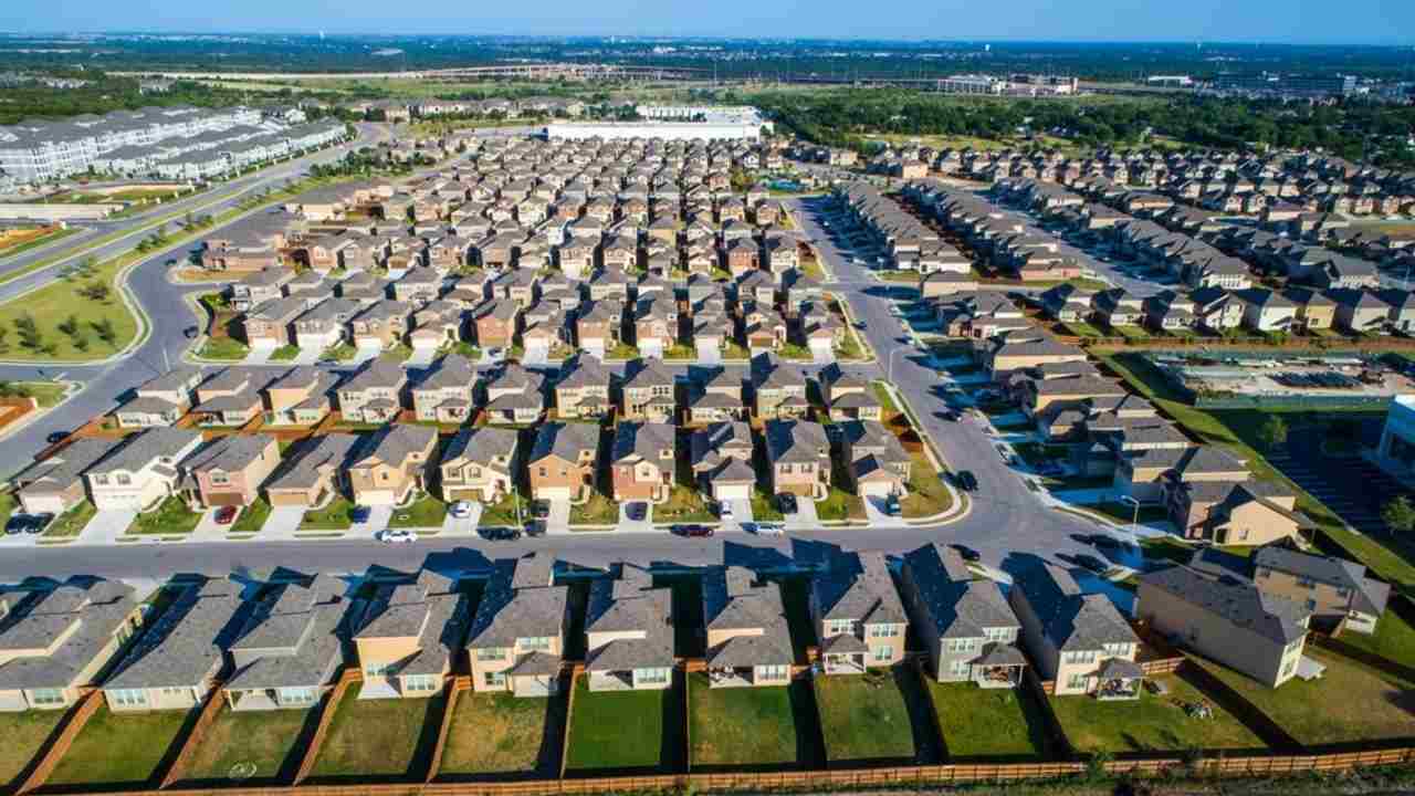 Perfect Standard Suburban Neighborhood Aerial Drone View above the entire development in North Austin right next to Round Rock , TX a perfect repeating pattern of Homes wide angle entire neighborhood